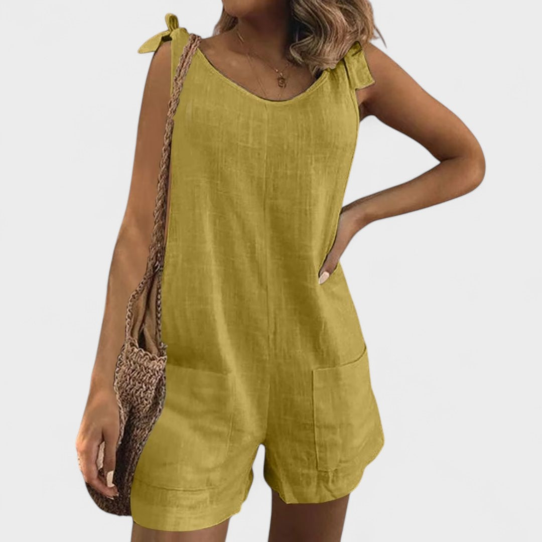 Yolanda - Jumpsuit med lommer på skuldrene og en elegant sløjfe