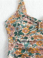 Luísa - badedragt med halterneck og blomsterprint